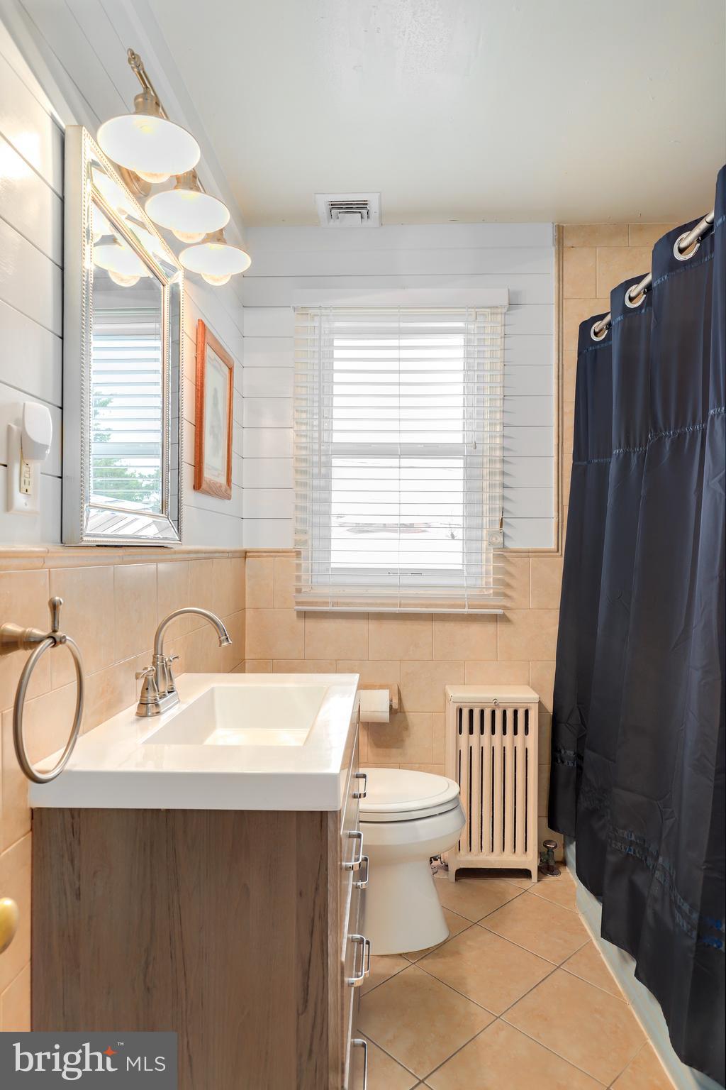 5545 Gayland Road Baltimore, MD 21227 - Photo 16 of 30 a bathroom with a sink and a mirror