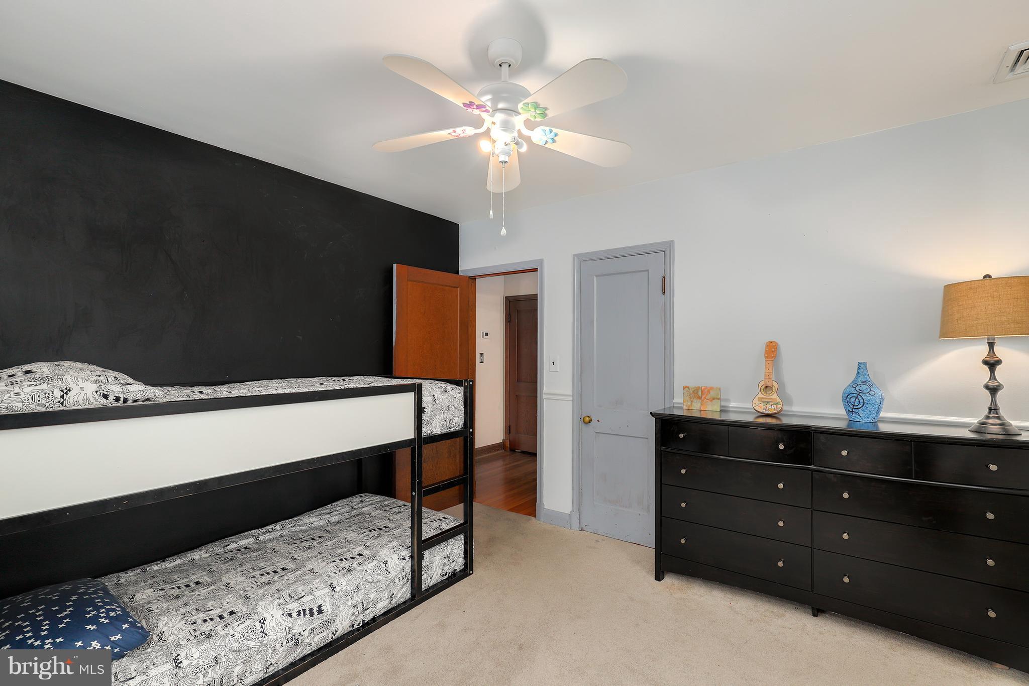 5545 Gayland Road Baltimore, MD 21227 - Photo 17 of 30 a bedroom with a bed and a dresser