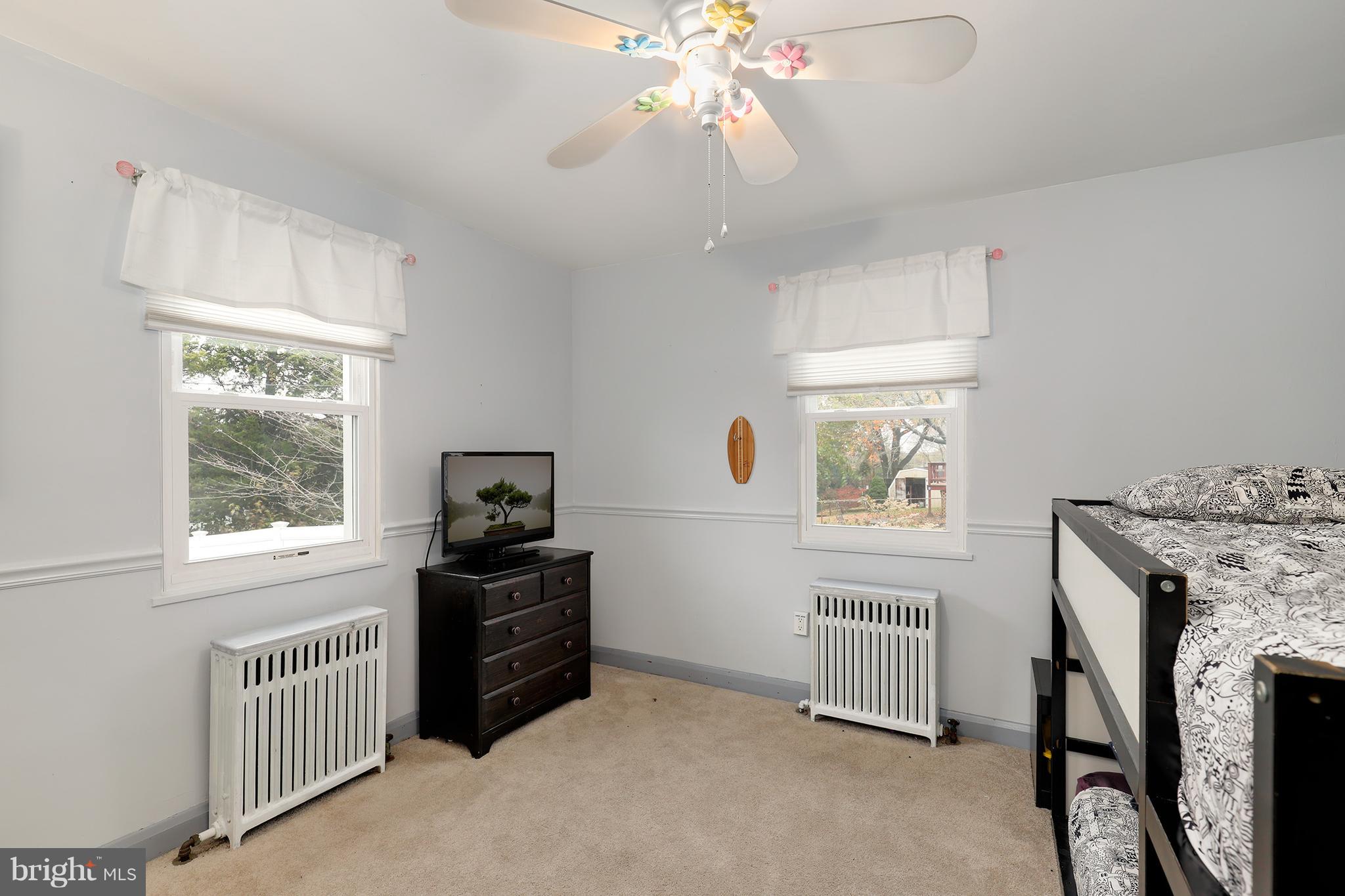 5545 Gayland Road Baltimore, MD 21227 - Photo 18 of 30 a bedroom with a bed and a window