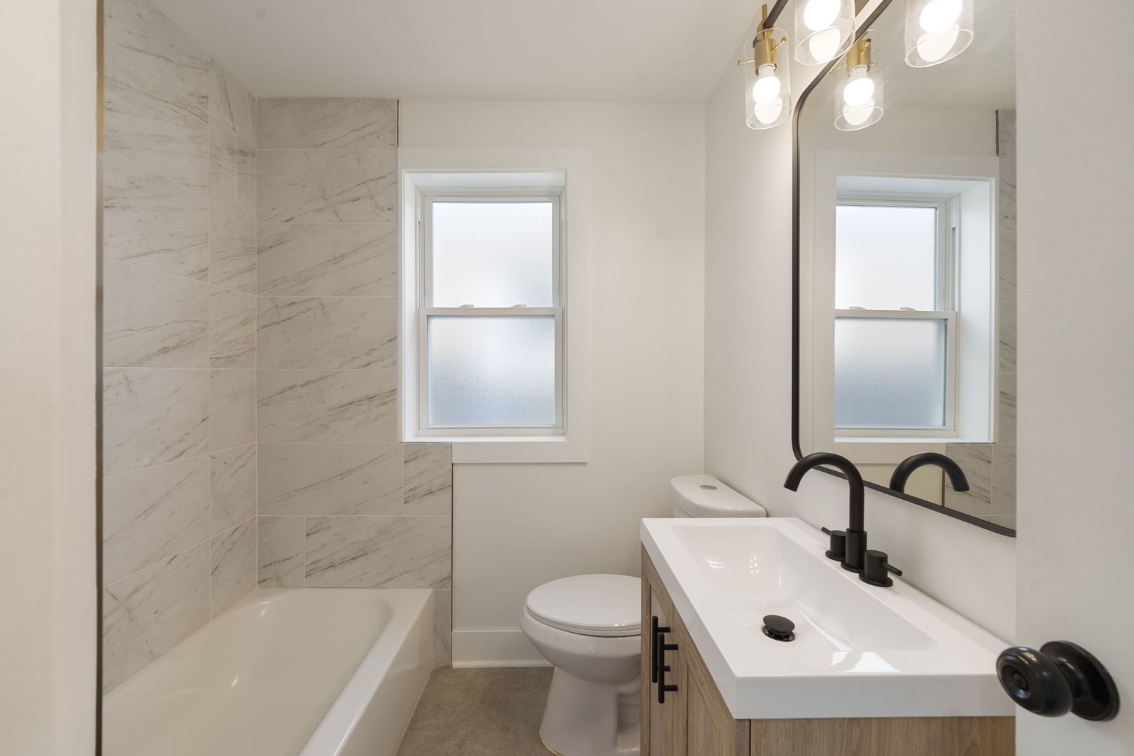 2733 Wesley Avenue Berwyn, IL 60402 - Photo 12 of 33 a bathroom with a sink a toilet and shower