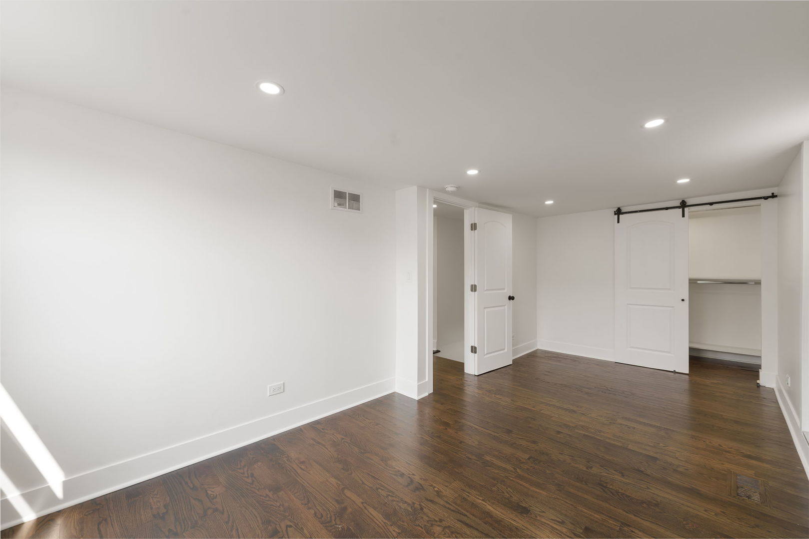 2733 Wesley Avenue Berwyn, IL 60402 - Photo 19 of 33 a view of an empty room with wooden floor