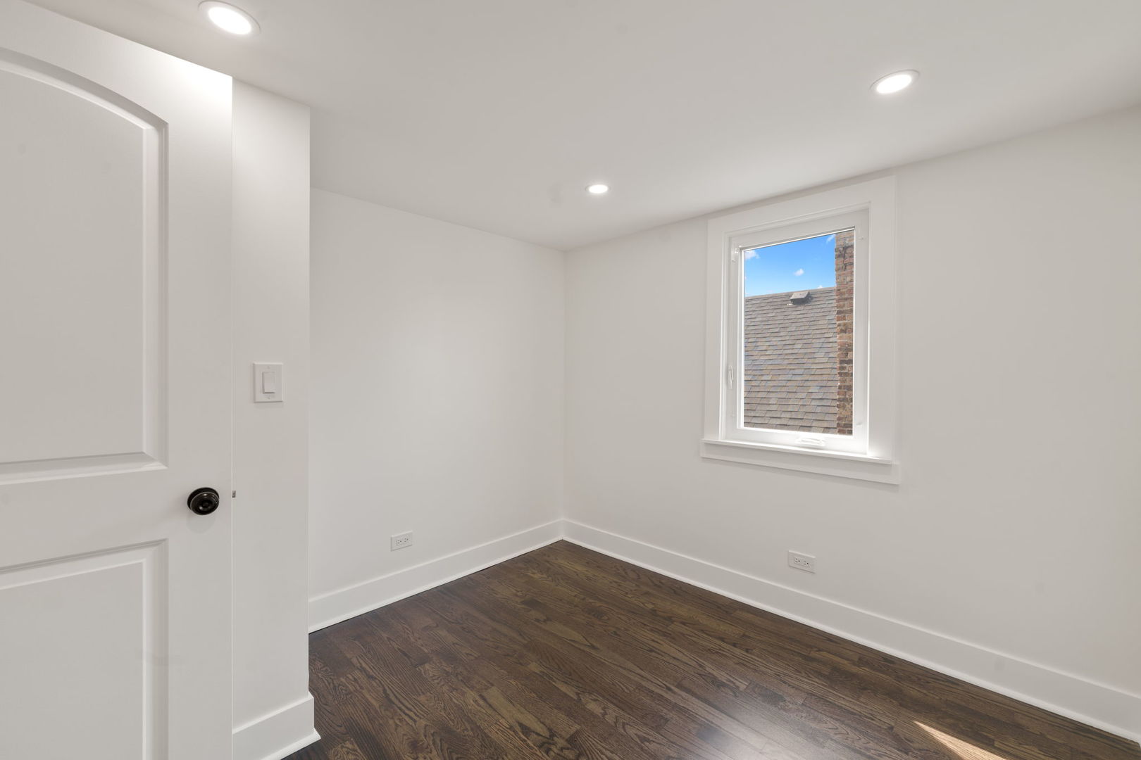 2733 Wesley Avenue Berwyn, IL 60402 - Photo 20 of 33 an empty room with wooden floor and windows