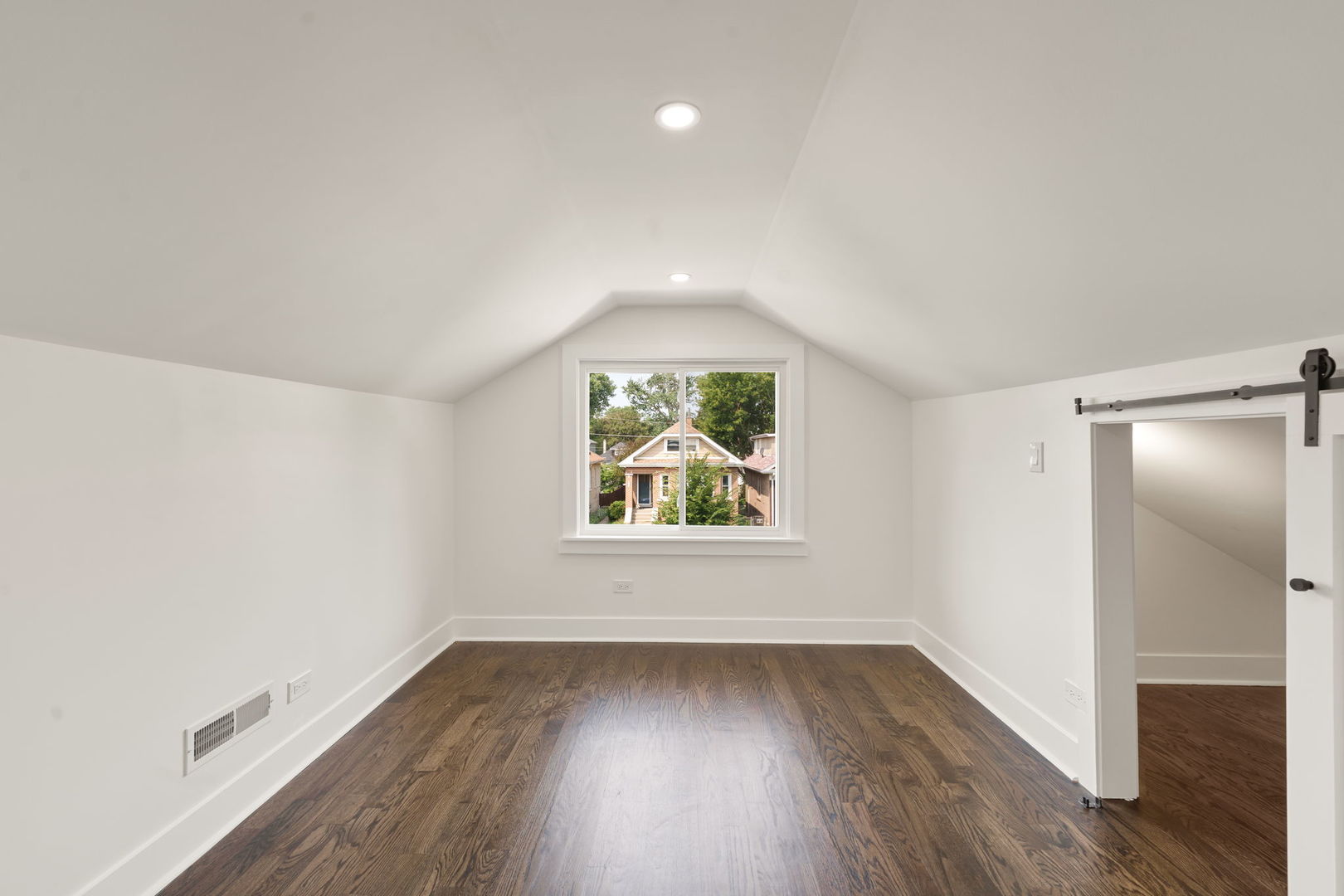 2733 Wesley Avenue Berwyn, IL 60402 - Photo 23 of 33 an empty room with wooden floor and windows