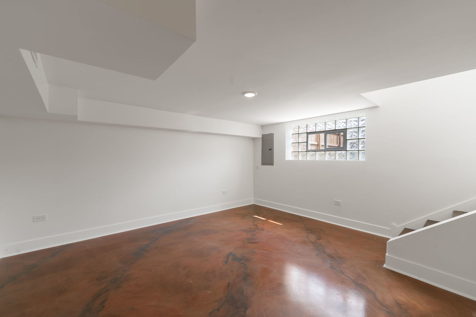 2733 Wesley Avenue Berwyn, IL 60402 - Photo 24 of 33 an empty room with wooden floor and windows