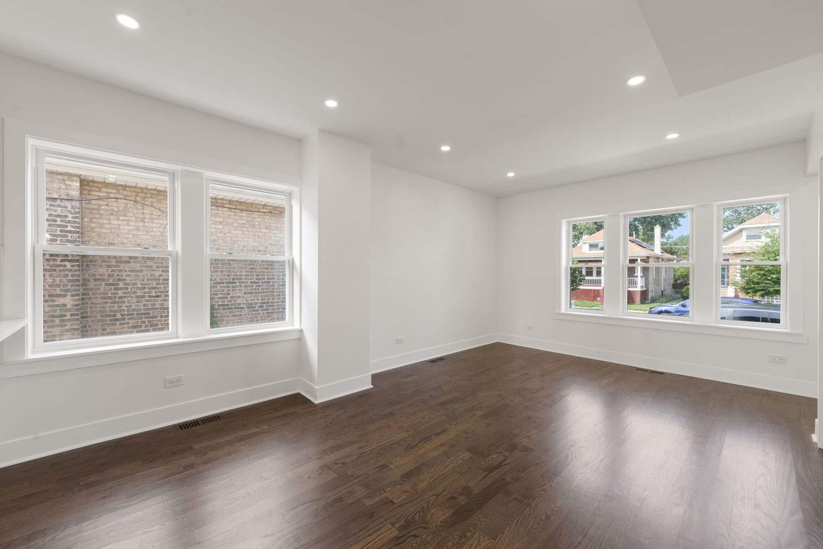 2733 Wesley Avenue Berwyn, IL 60402 - Photo 3 of 33 a view of an empty room with wooden floor and a window