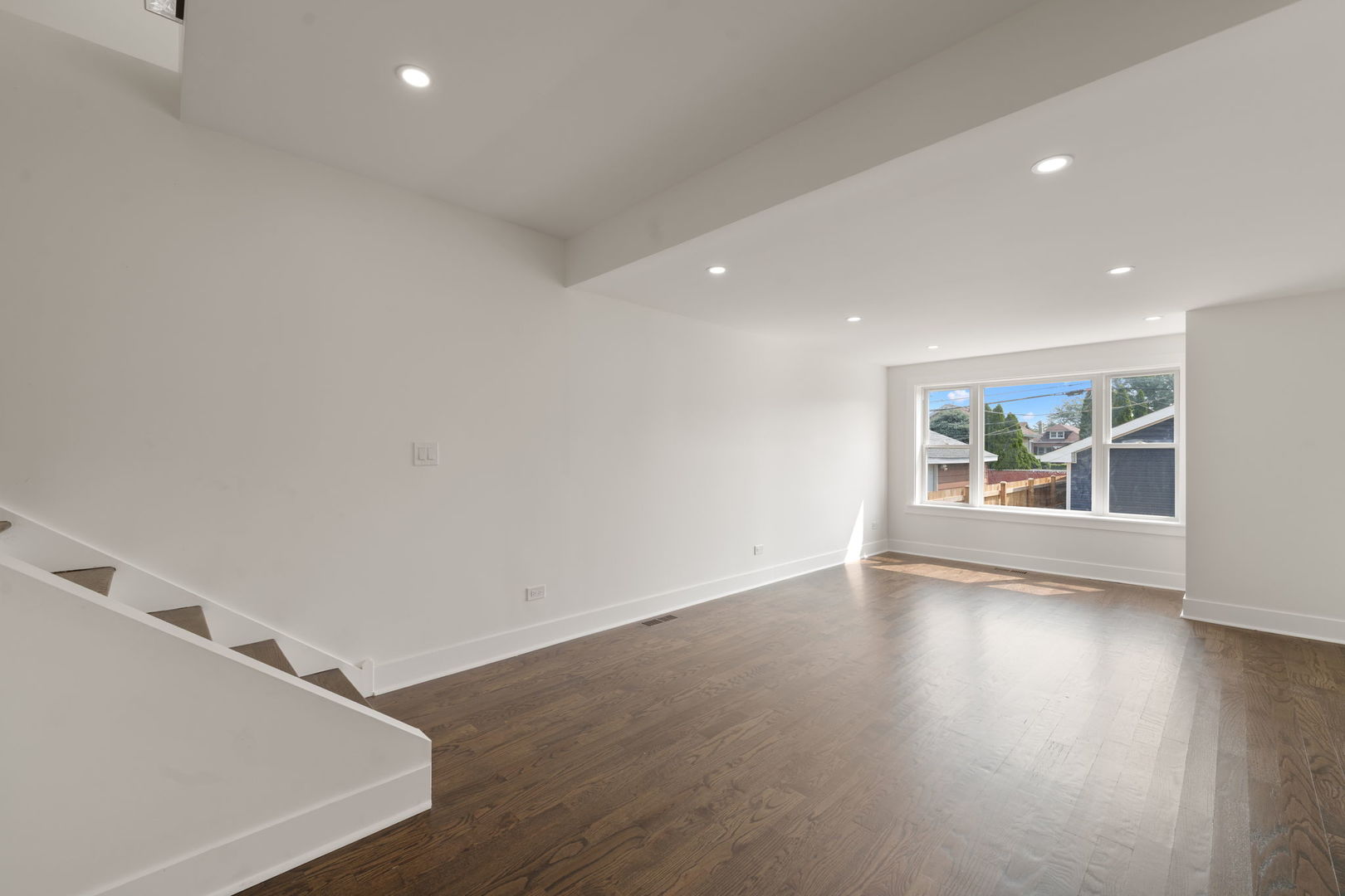 2733 Wesley Avenue Berwyn, IL 60402 - Photo 9 of 33 an empty room with window and wooden floor