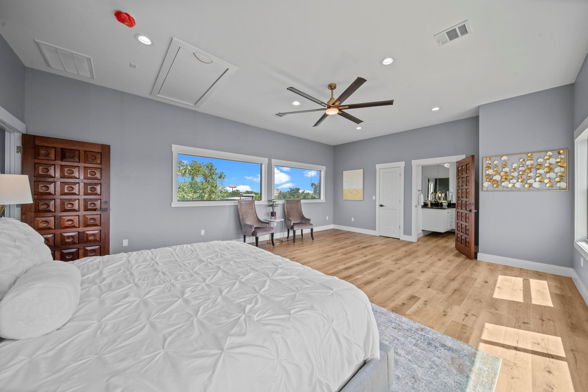 601 Cottage Street Houston, TX 77009 - Photo 39 of 48 Spacious primary bedroom with lots of natural light. This room is the WOW factor in this home so don't miss it. (staged)