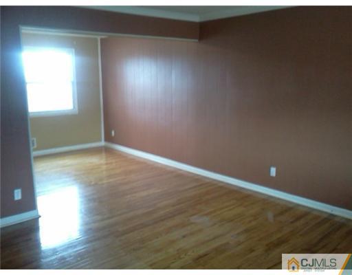 19 Wilshire Road Edison, NJ 08817 - Photo 4 of 7 a view of an empty room and window