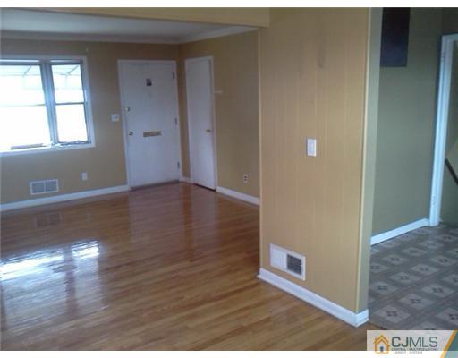 19 Wilshire Road Edison, NJ 08817 - Photo 5 of 7 a view of a livingroom with wooden floor
