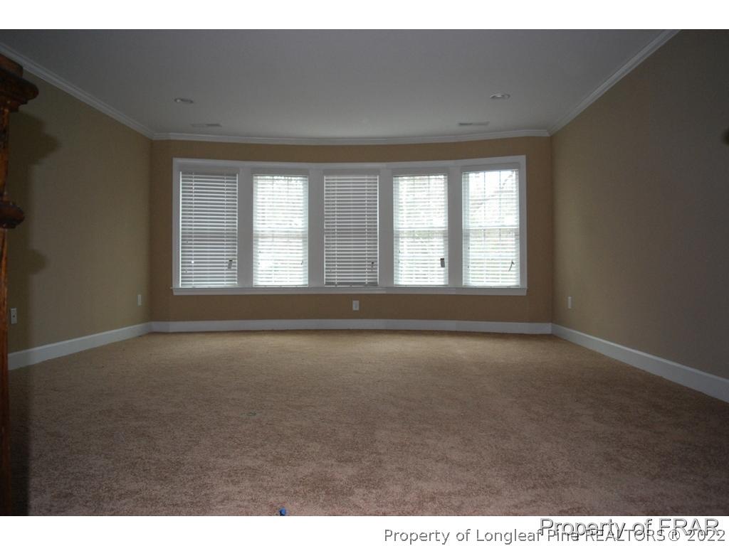 22 Spring Pond Lane Spring Lake, NC 28390 - Photo 17 of 35 a view of an empty room with a window