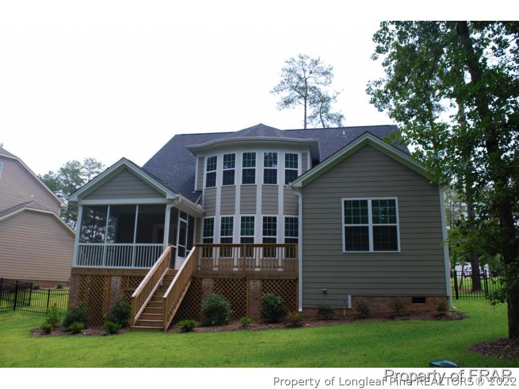 22 Spring Pond Lane Spring Lake, NC 28390 - Photo 33 of 35 a view of a house with a yard