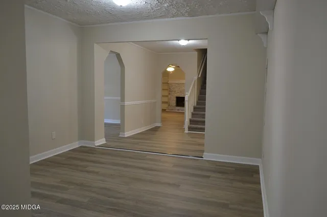 a bathroom with a toilet and a bathtub