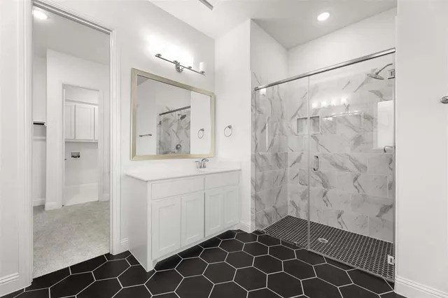 a bathroom with a shower and a sink