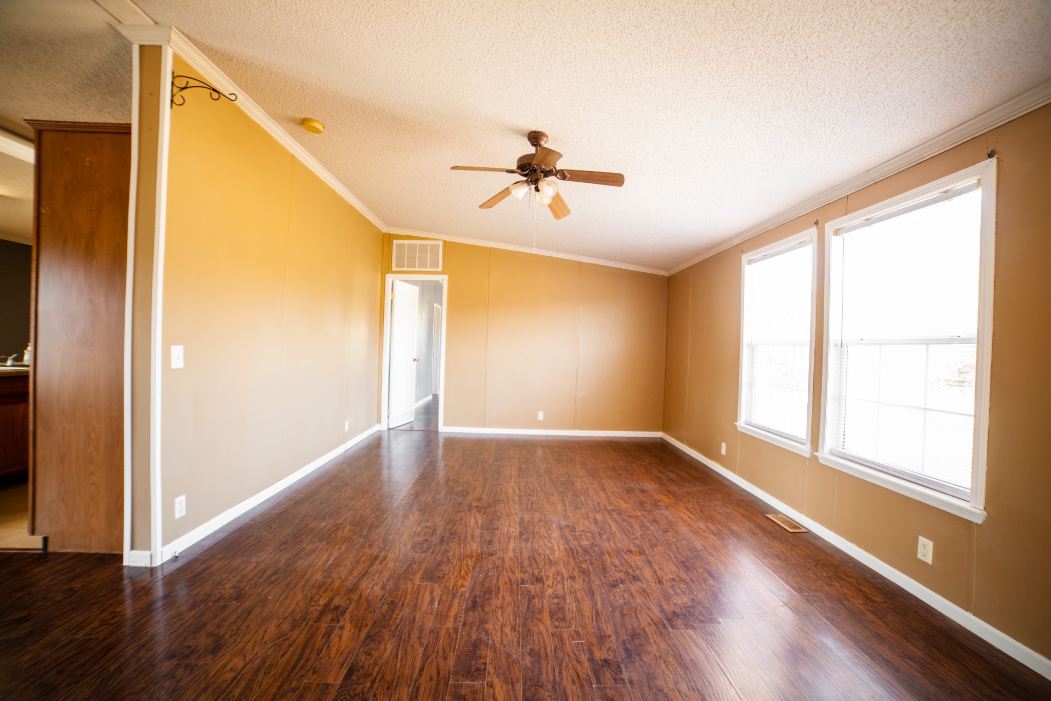 1606 Harpo Road Manchester, TN 37355 - Photo 15 of 27 wooden floor in an empty room with a window