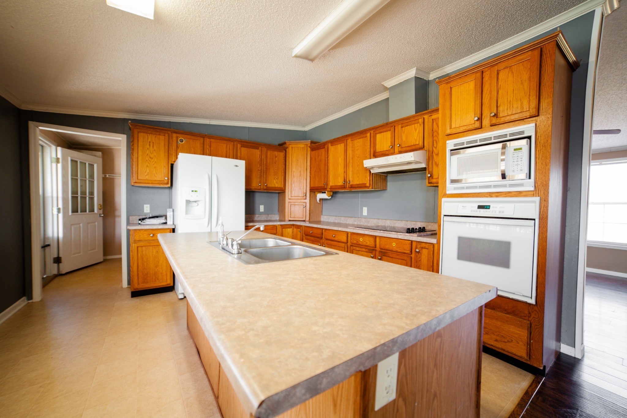1606 Harpo Road Manchester, TN 37355 - Photo 16 of 27 a kitchen with a window a sink and a refrigerator