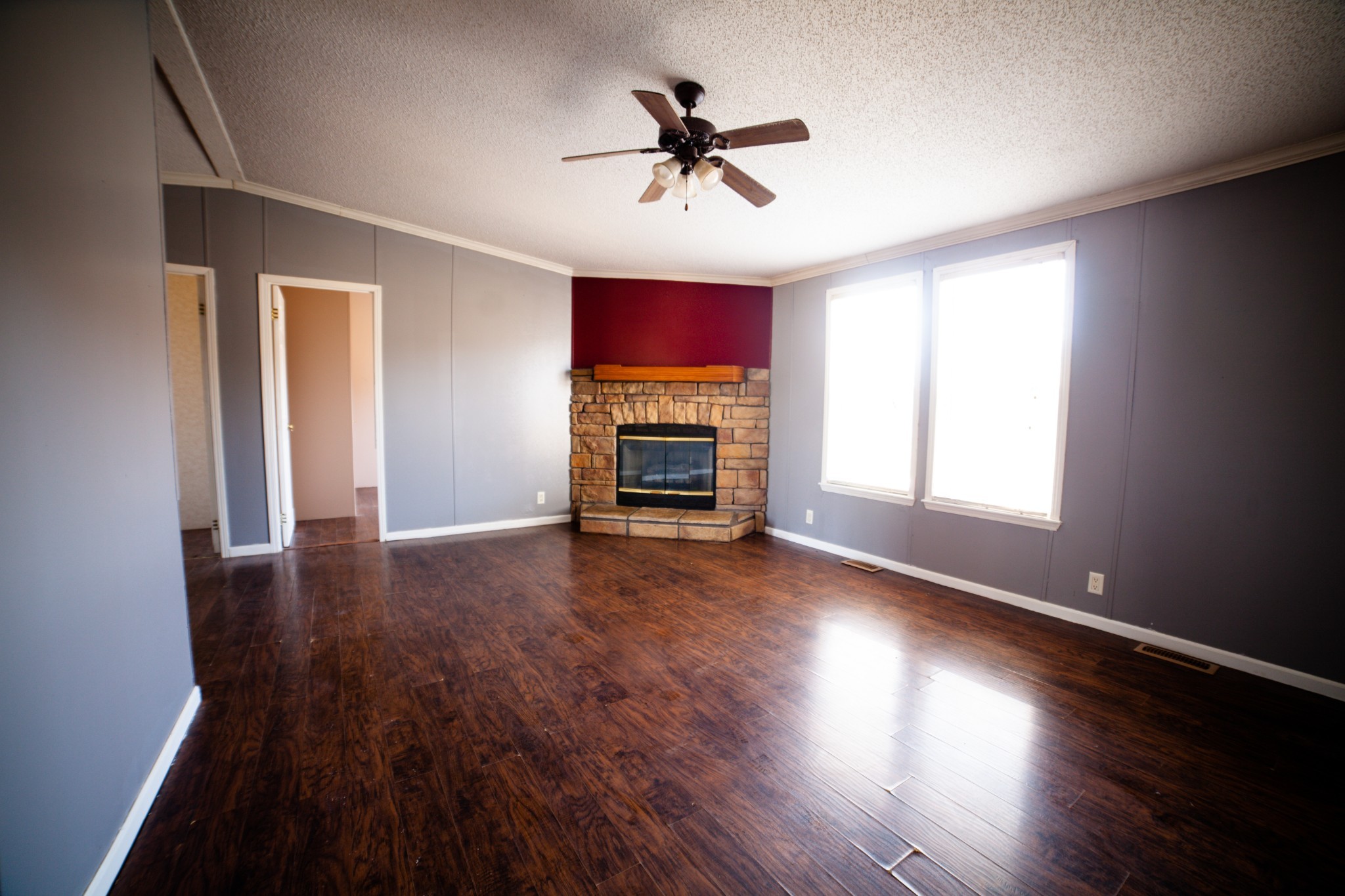1606 Harpo Road Manchester, TN 37355 - Photo 6 of 27 wooden floor in an empty room with a window