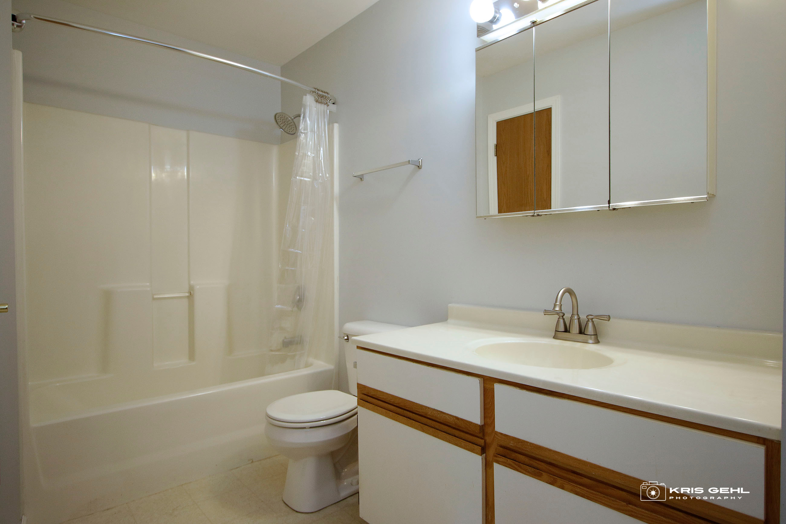 1551 Crystal Rock Court, Unit 1D Round Lake Beach, IL 60073 - Photo 11 of 16 a bathroom with a sink a toilet and shower
