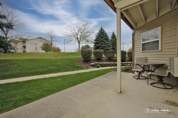 a view of backyard with wheel chair and potted plants