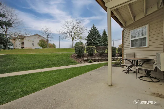 a view of backyard with wheel chair and potted plants