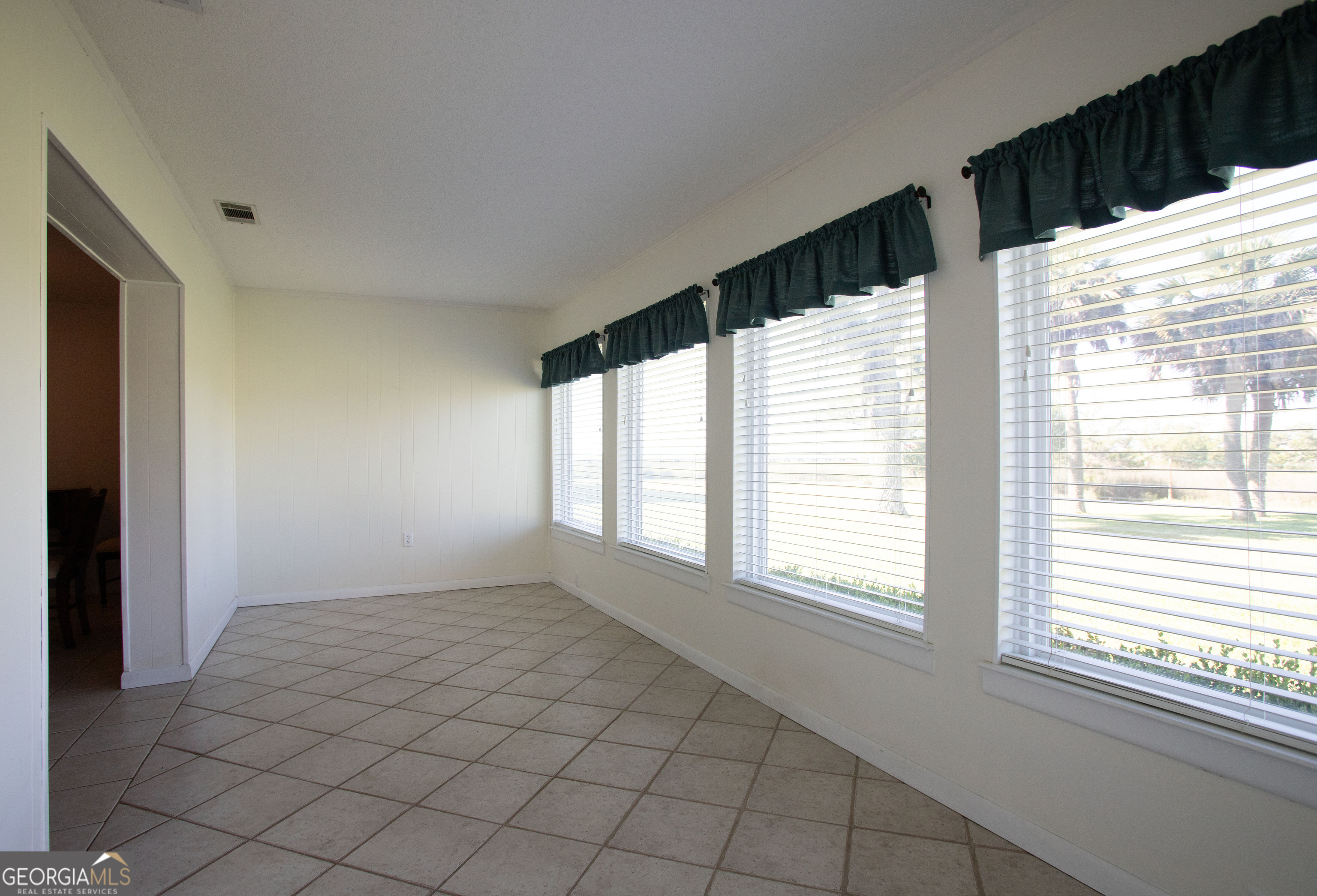 743 Cattle Hammock Road Midway, GA 31320 - Photo 13 of 63 a view of an empty room and window