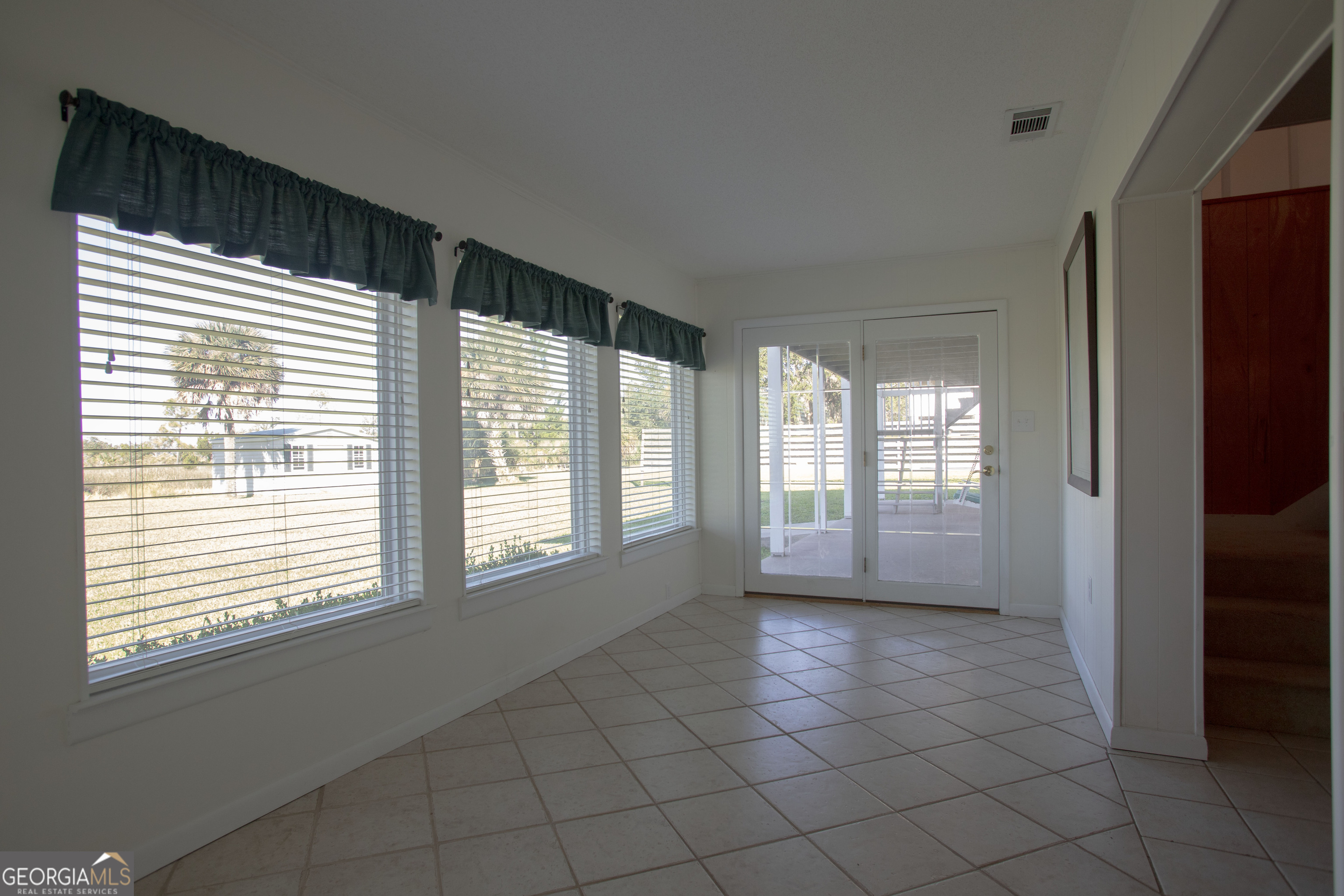743 Cattle Hammock Road Midway, GA 31320 - Photo 14 of 63 a view of an empty room with a window