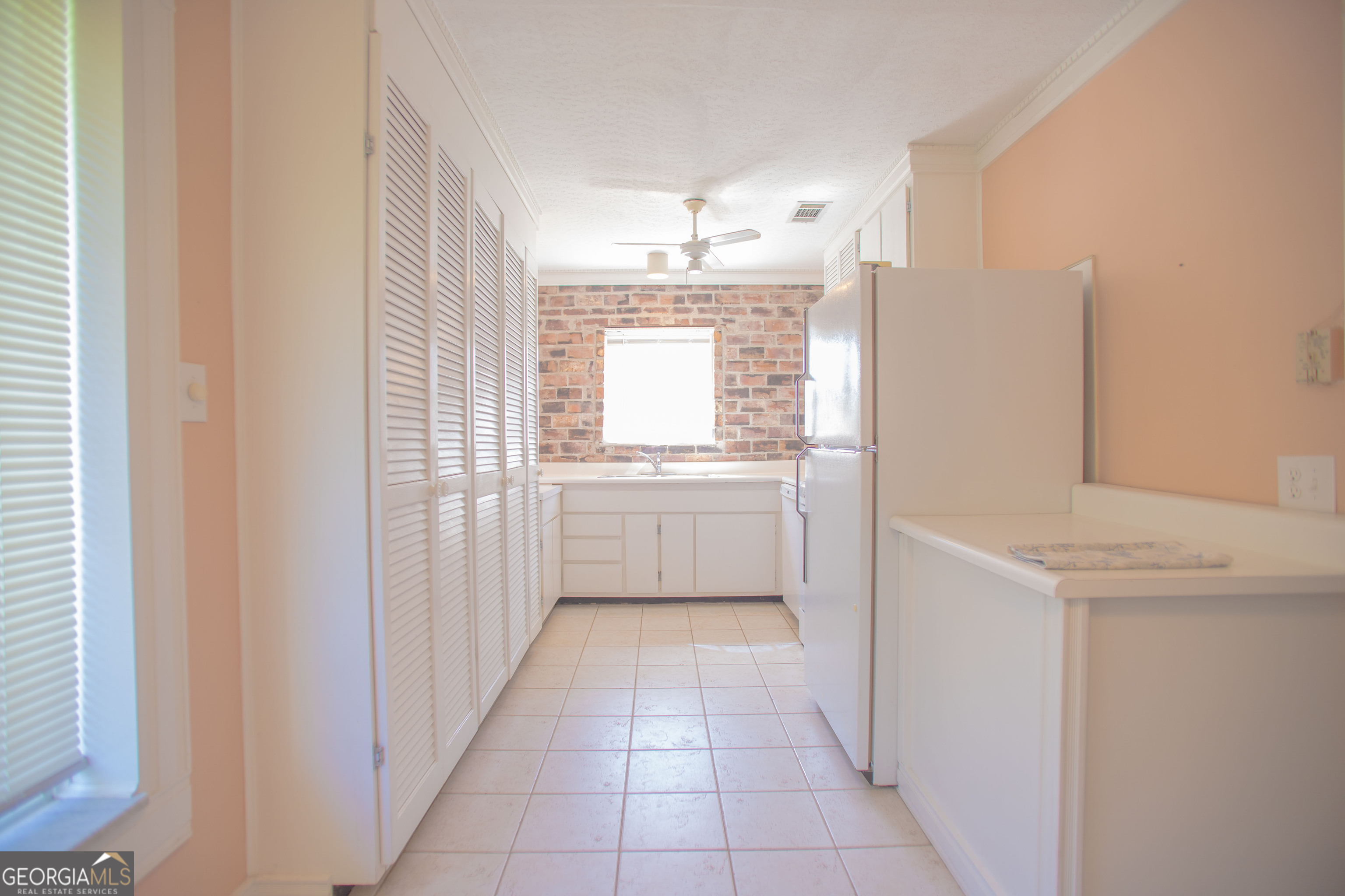 743 Cattle Hammock Road Midway, GA 31320 - Photo 26 of 63 a kitchen with a white cabinets and a sink