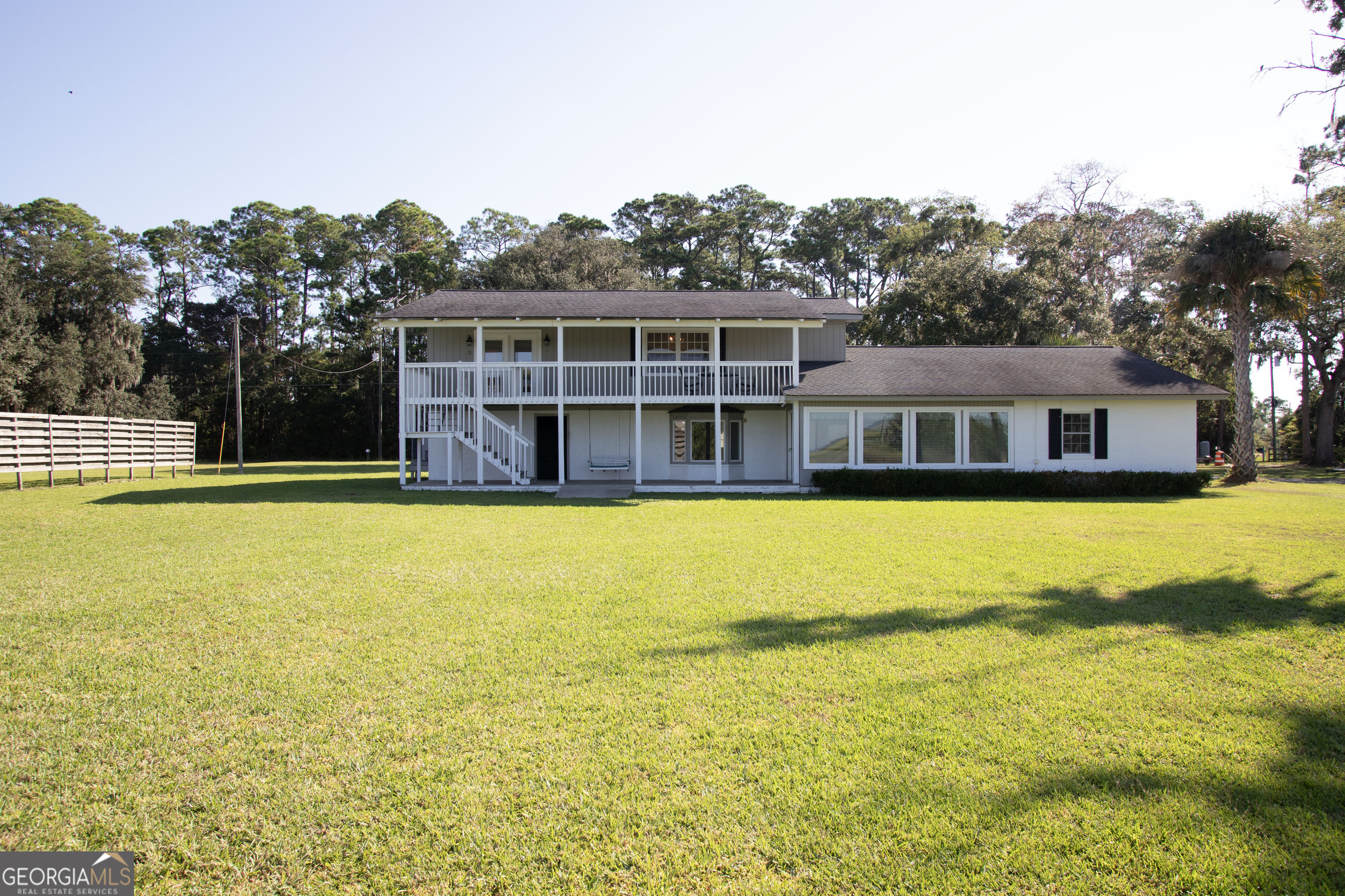 743 Cattle Hammock Road Midway, GA 31320 - Photo 30 of 63 a view of a house with a swimming pool
