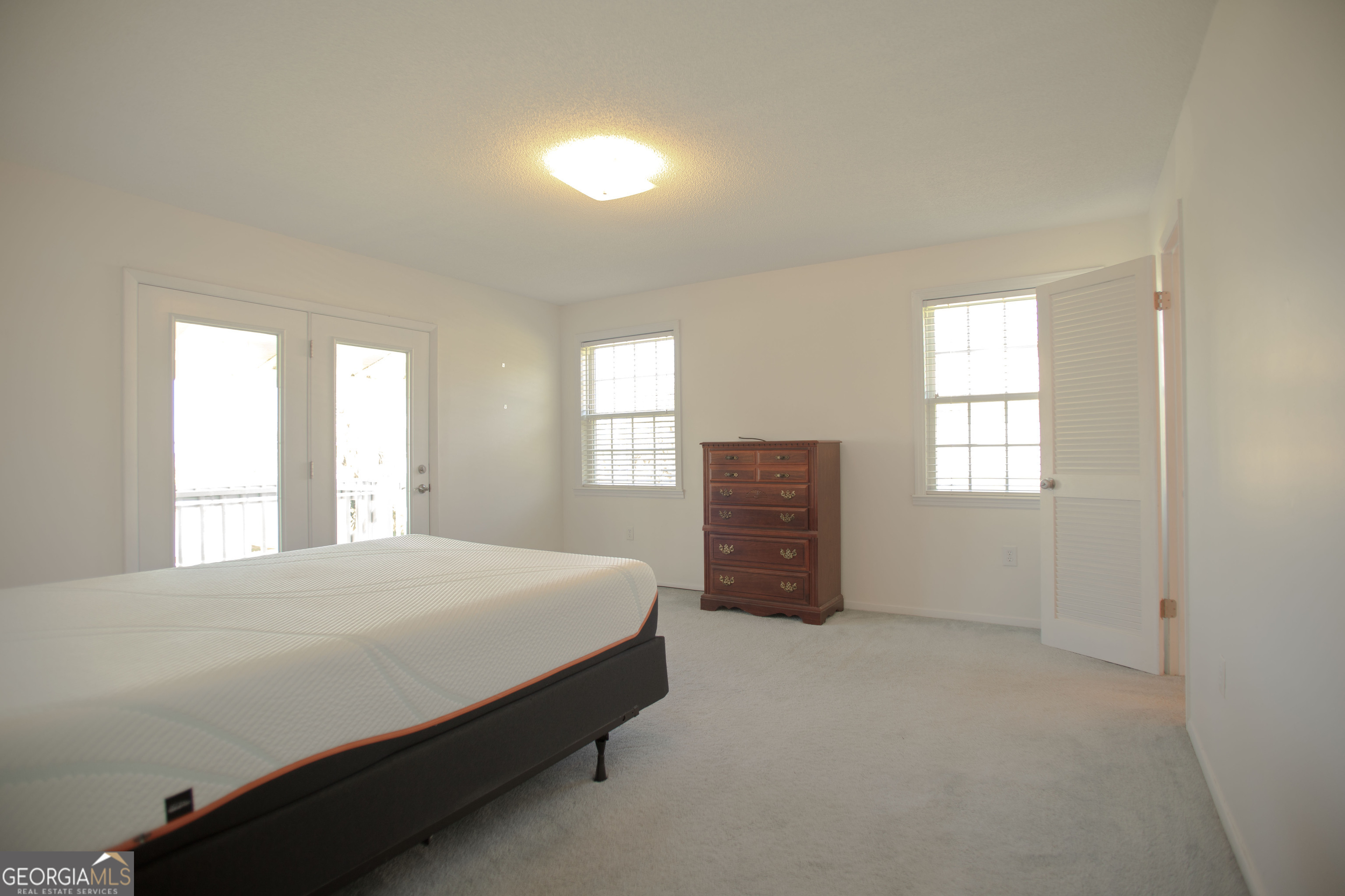 743 Cattle Hammock Road Midway, GA 31320 - Photo 42 of 63 a bedroom with a bed and a window