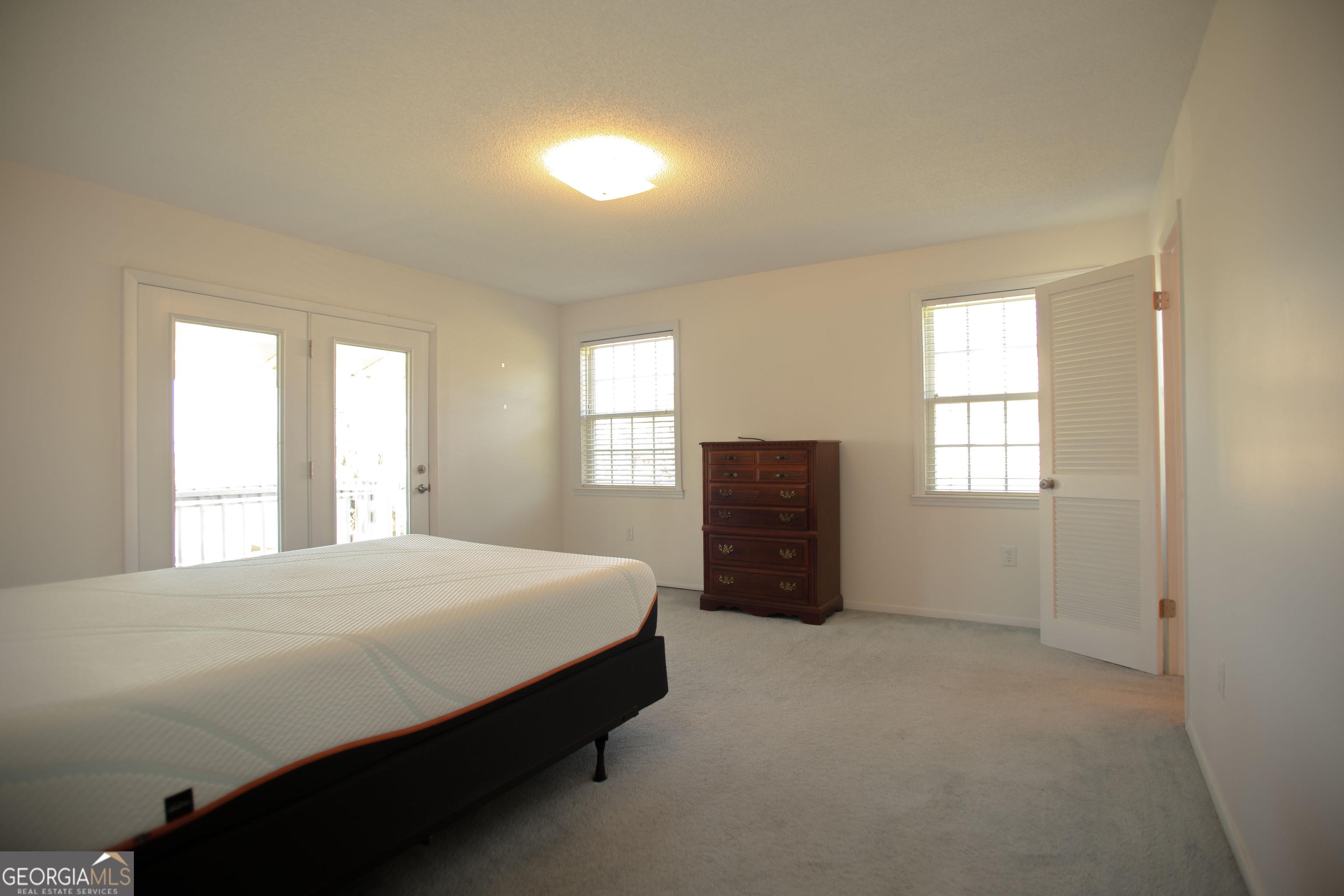 743 Cattle Hammock Road Midway, GA 31320 - Photo 43 of 63 a bedroom with a bed and a window