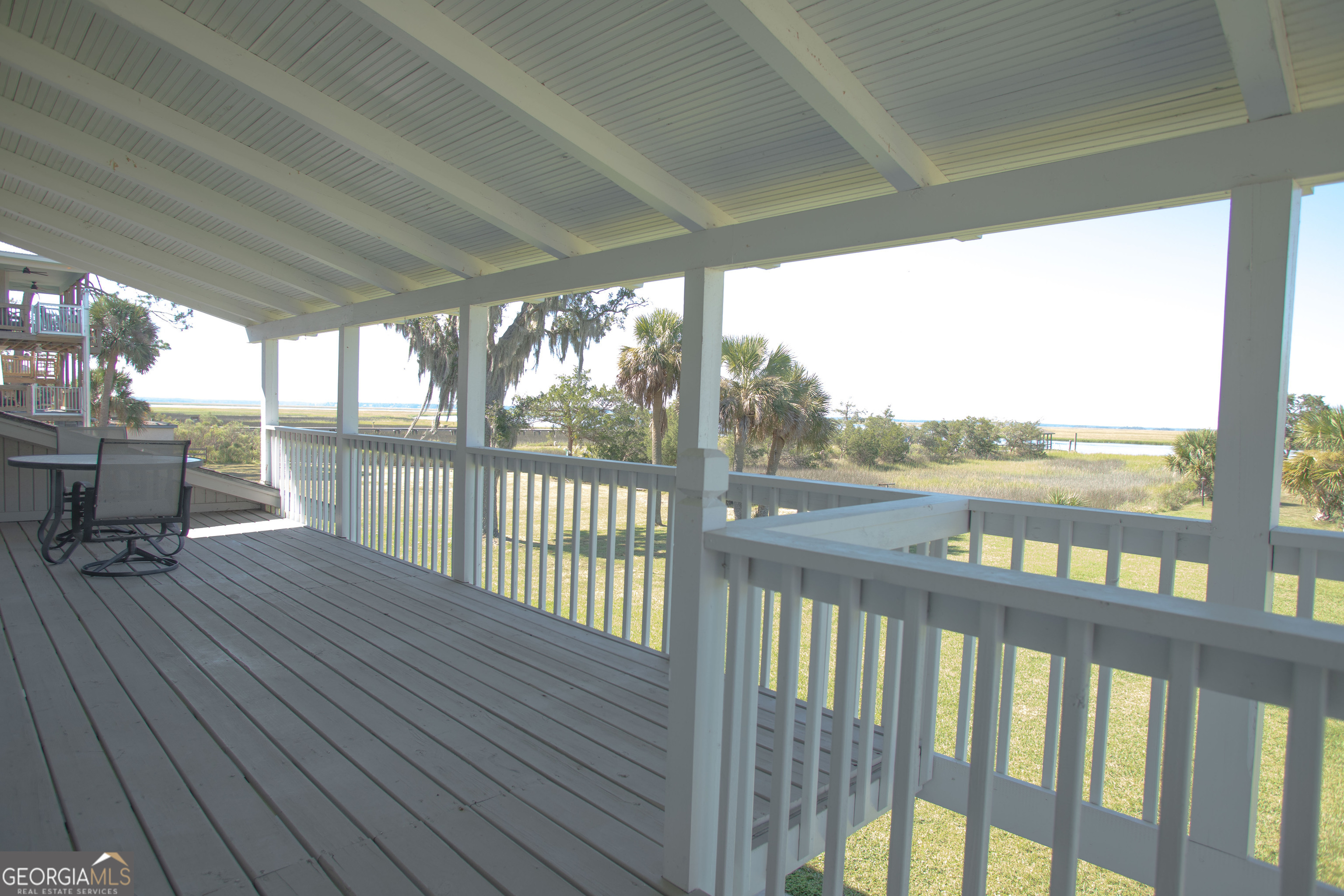 743 Cattle Hammock Road Midway, GA 31320 - Photo 45 of 63 a view of a deck with wooden floor and outdoor space