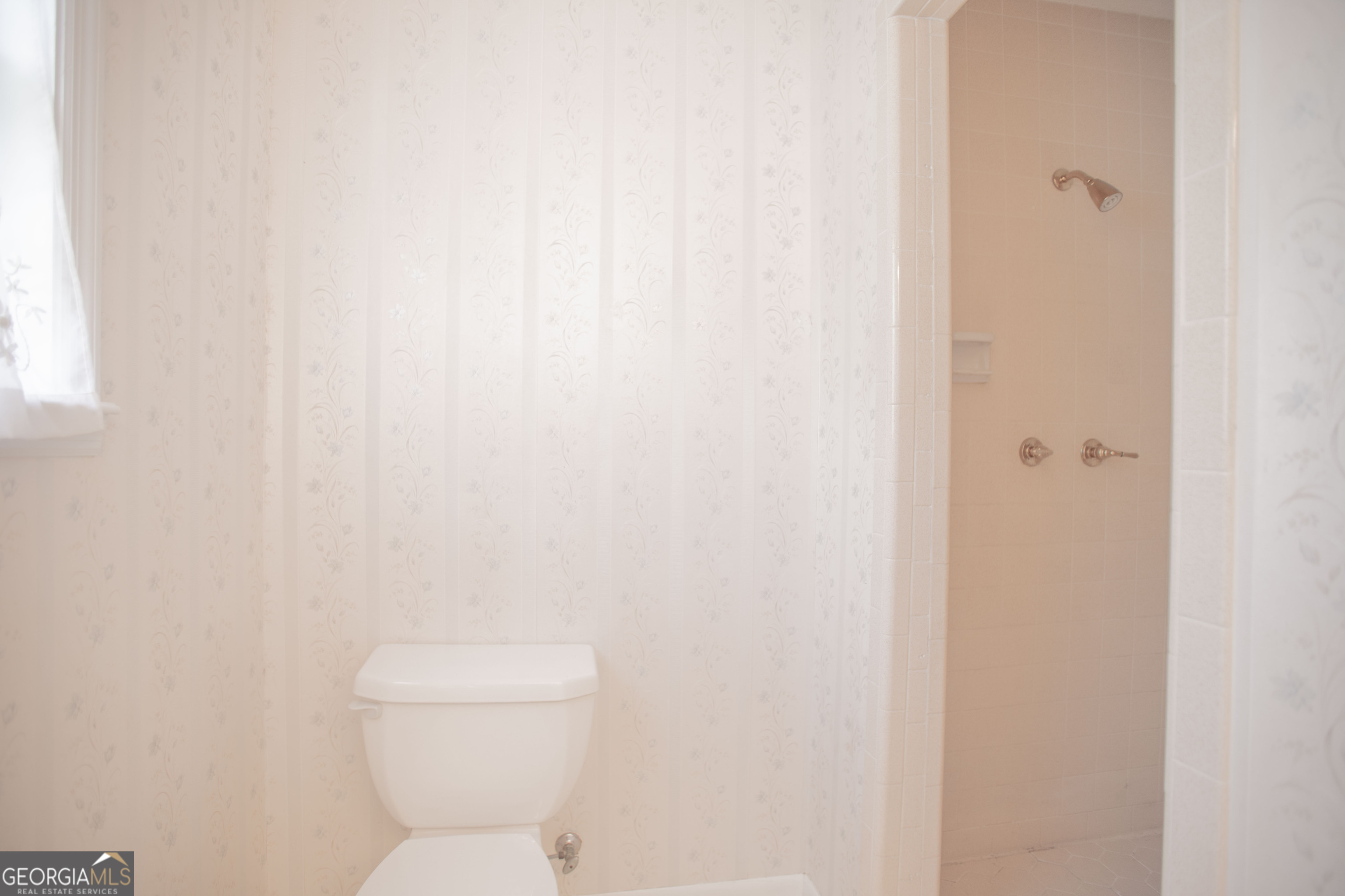 743 Cattle Hammock Road Midway, GA 31320 - Photo 50 of 63 a white toilet sitting next to a shower