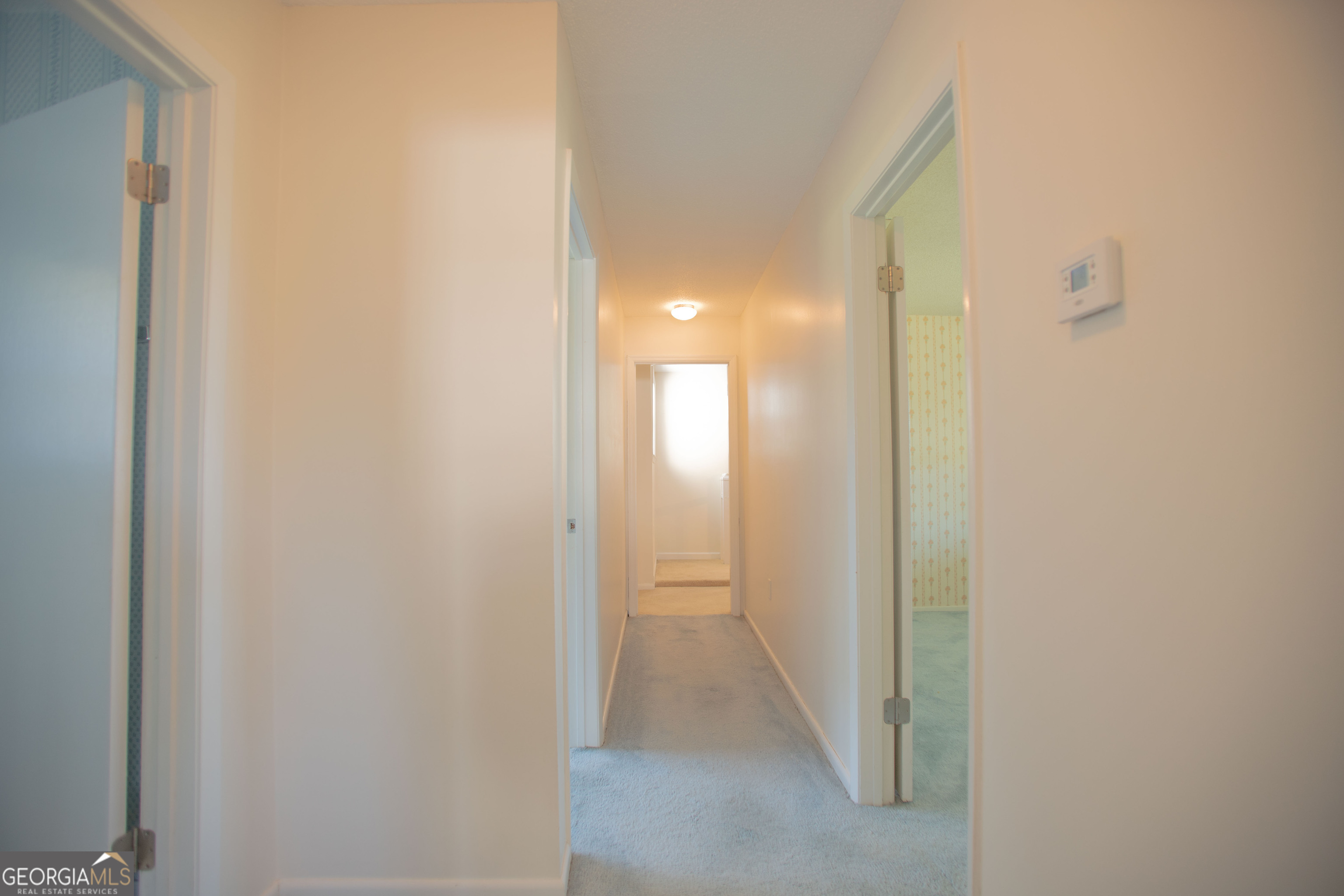 743 Cattle Hammock Road Midway, GA 31320 - Photo 51 of 63 a view of a hallway with wooden floor