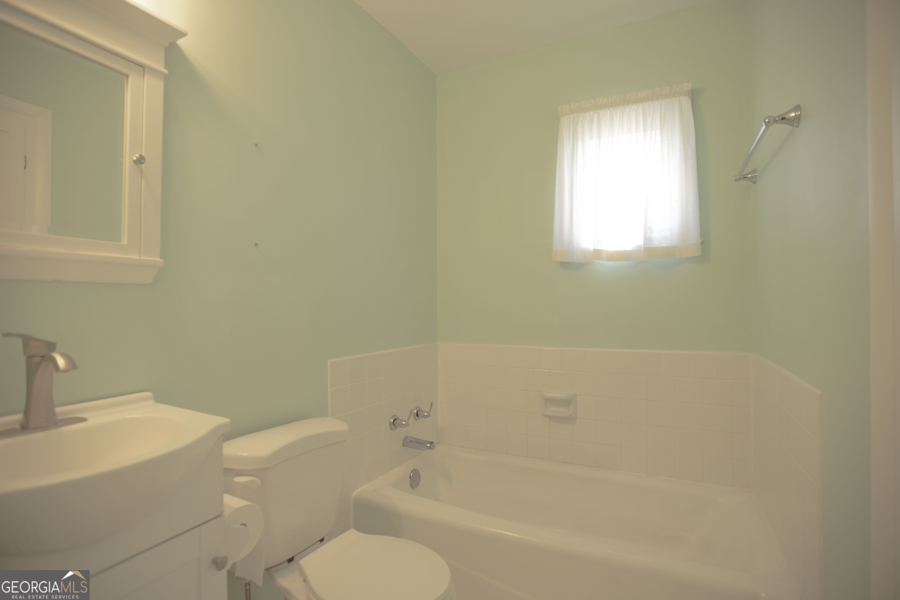 743 Cattle Hammock Road Midway, GA 31320 - Photo 55 of 63 a white bath tub sitting next to a white toilet