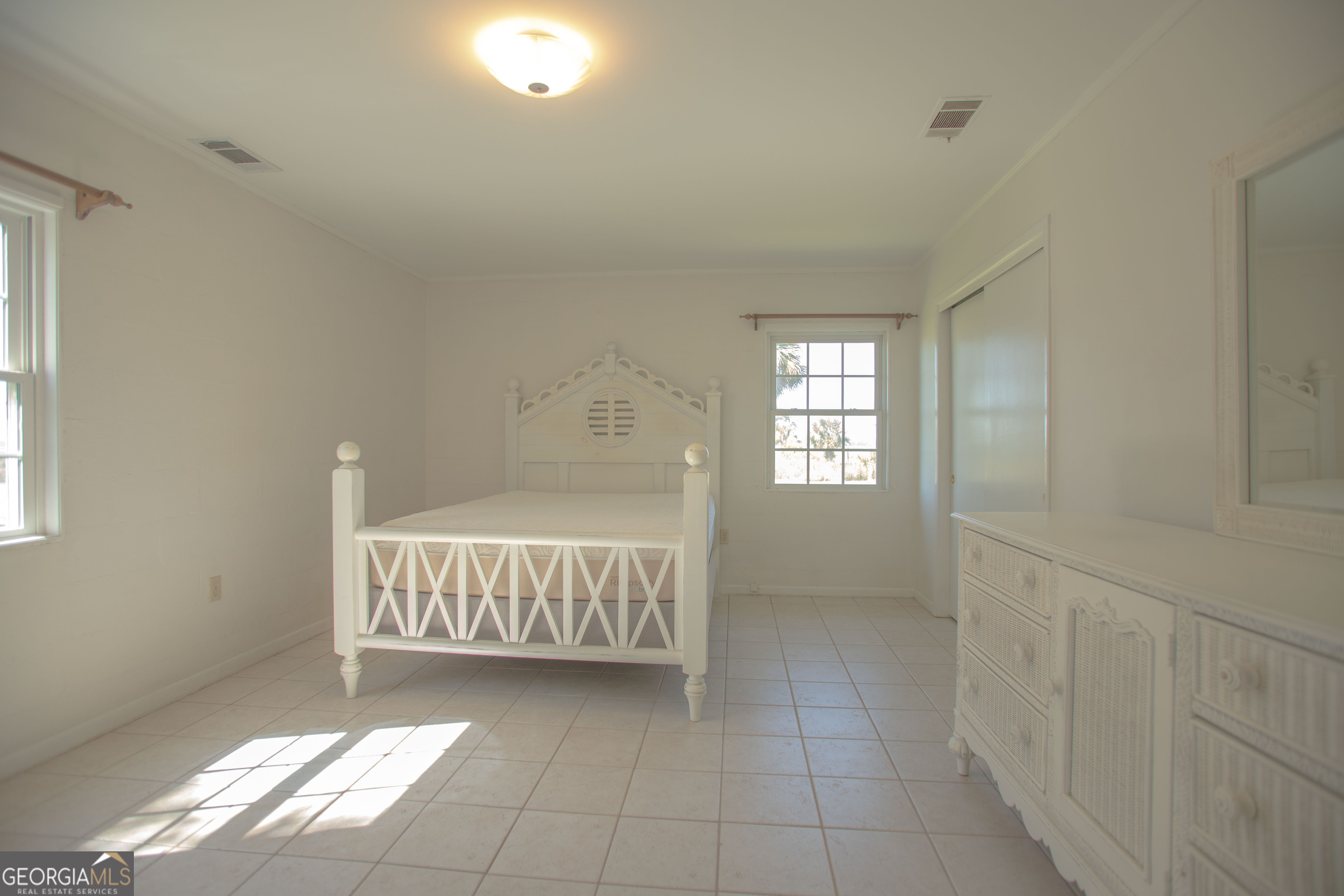 743 Cattle Hammock Road Midway, GA 31320 - Photo 56 of 63 a view of a bedroom with window and hardwood floor