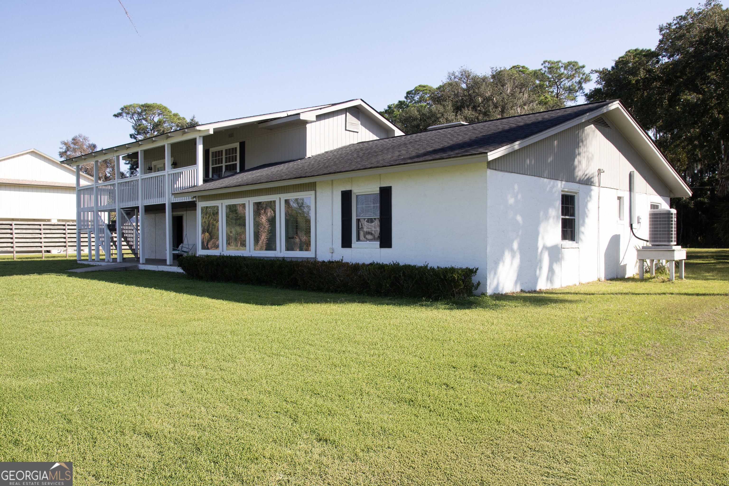 743 Cattle Hammock Road Midway, GA 31320 - Photo 10 of 63 a view of a house with pool and sitting area