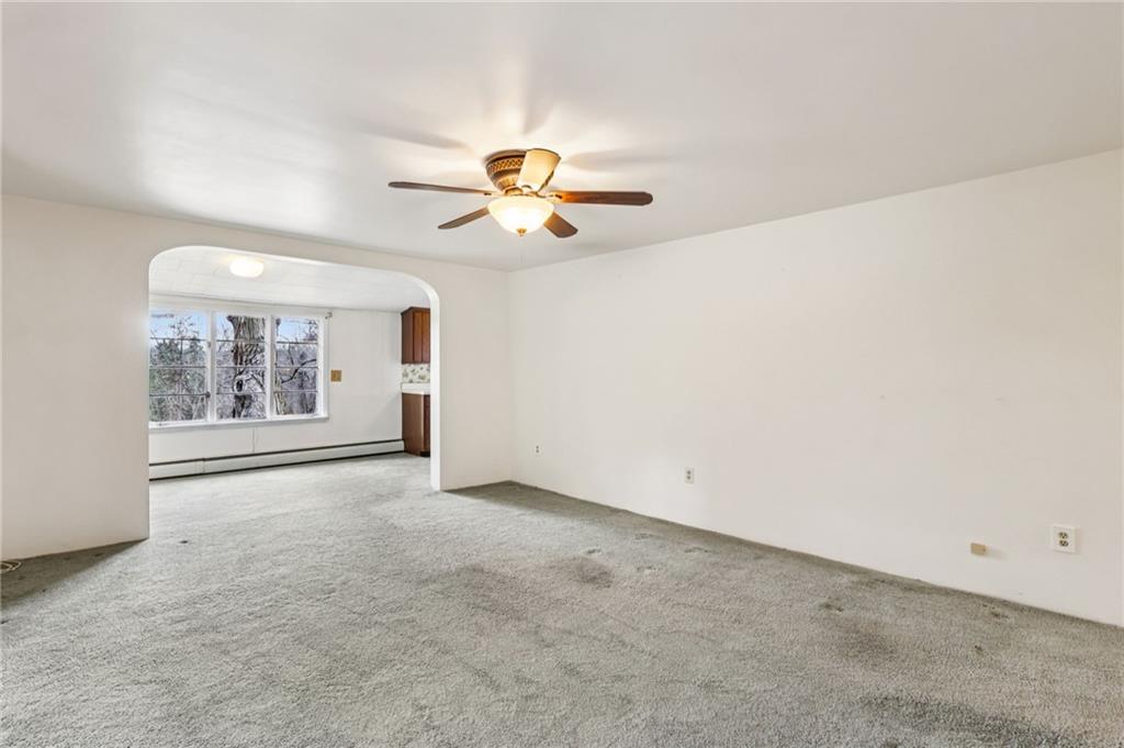 189 Lupyan Road New Alexandria, PA 15670 - Photo 12 of 50 an empty room with chandelier fan and windows