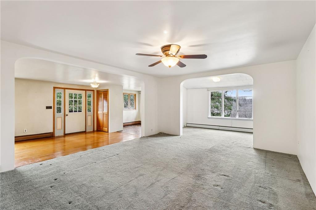 189 Lupyan Road New Alexandria, PA 15670 - Photo 13 of 50 an empty room with windows and chandelier fan