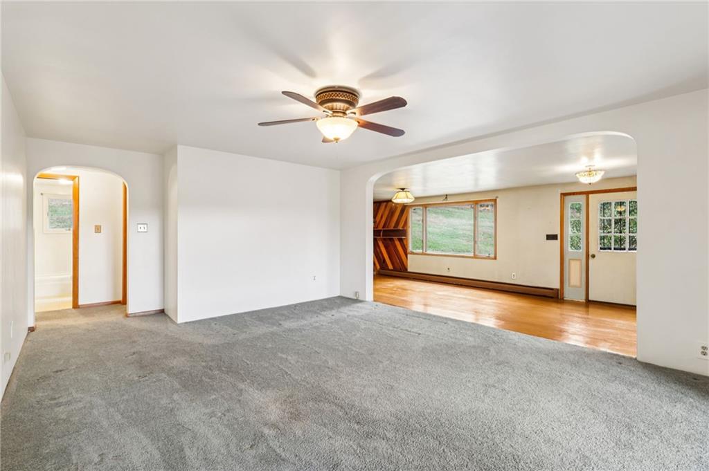189 Lupyan Road New Alexandria, PA 15670 - Photo 14 of 50 an empty room with chandelier fan and windows