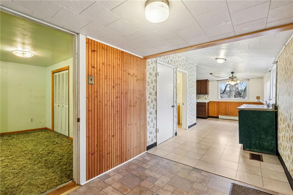 189 Lupyan Road New Alexandria, PA 15670 - Photo 17 of 50 a view of a hallway with dining area and chandelier