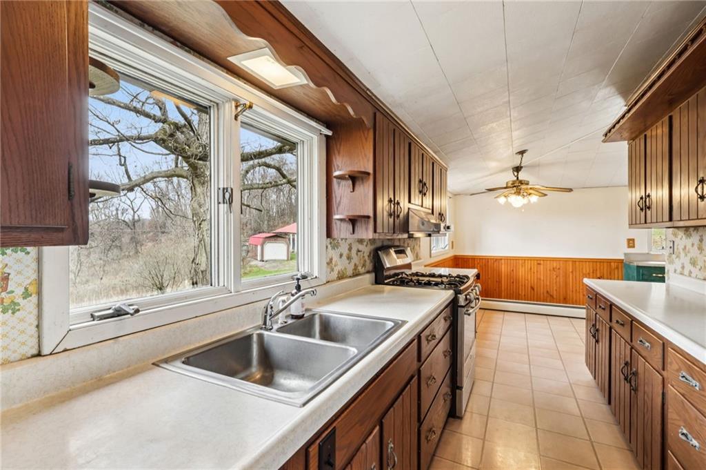 189 Lupyan Road New Alexandria, PA 15670 - Photo 22 of 50 a kitchen with a sink stove and cabinets