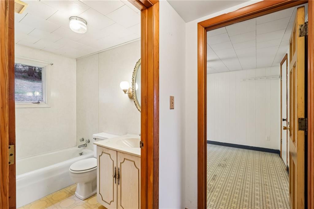 189 Lupyan Road New Alexandria, PA 15670 - Photo 24 of 50 a bathroom with a granite countertop toilet a sink and a shower