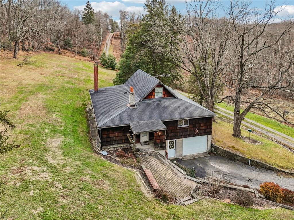 189 Lupyan Road New Alexandria, PA 15670 - Photo 34 of 50 a view of a house with a yard covered in the forest