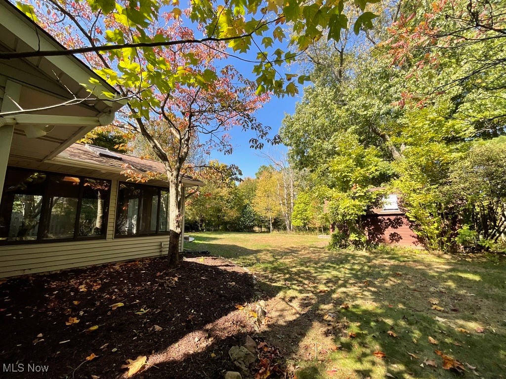 11331 Palmer Road Painesville, OH 44077 - Photo 30 of 47 View of yard featuring a sunroom