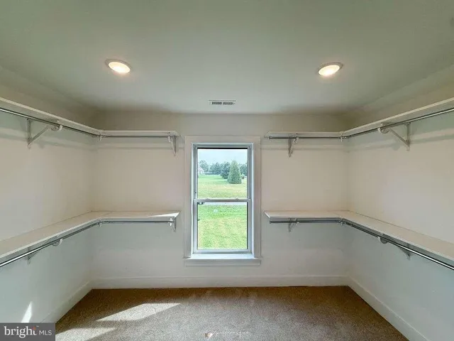 a view of a room with racks on the wall