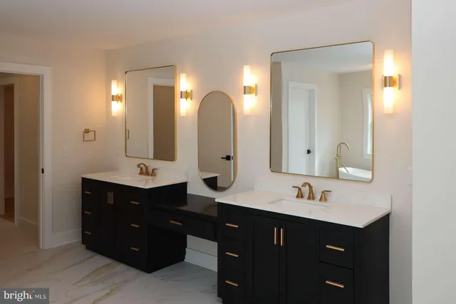 a bath tub sitting in a bathroom next to a window
