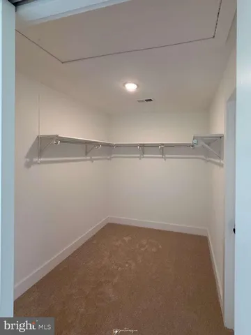a bathroom with a granite countertop sink mirror and bathtub