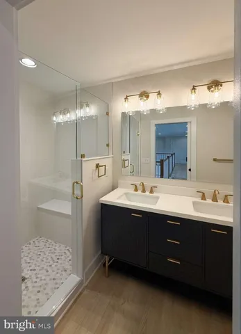 a bathroom with a shower a toilet and a sink