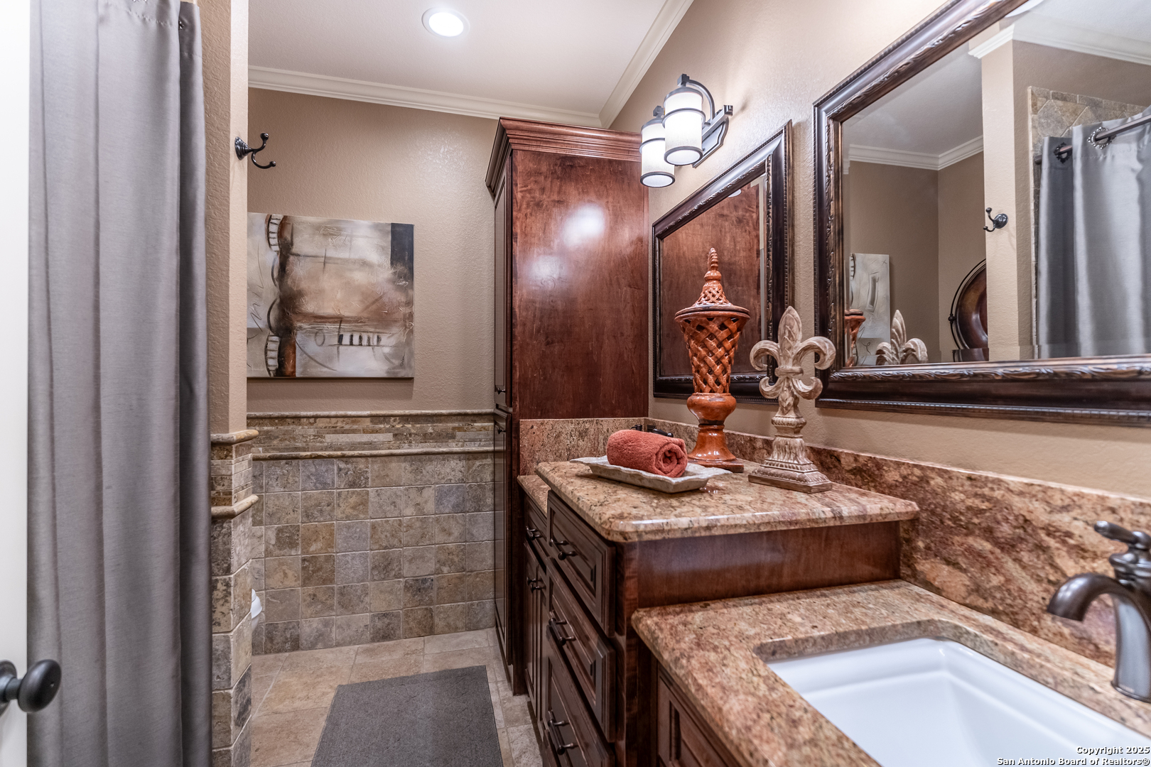 935 Danda Lane Del Rio, TX 78840 - Photo 13 of 38 a bathroom with a granite countertop sink a mirror and shower