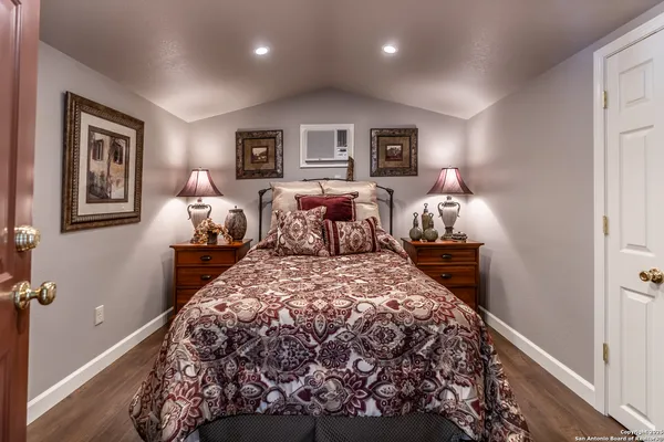 a bed room with a bed and a window