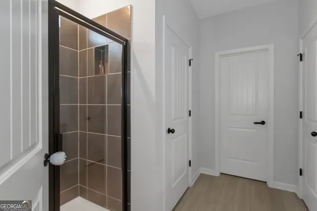 a bathroom with a bathtub and a shower